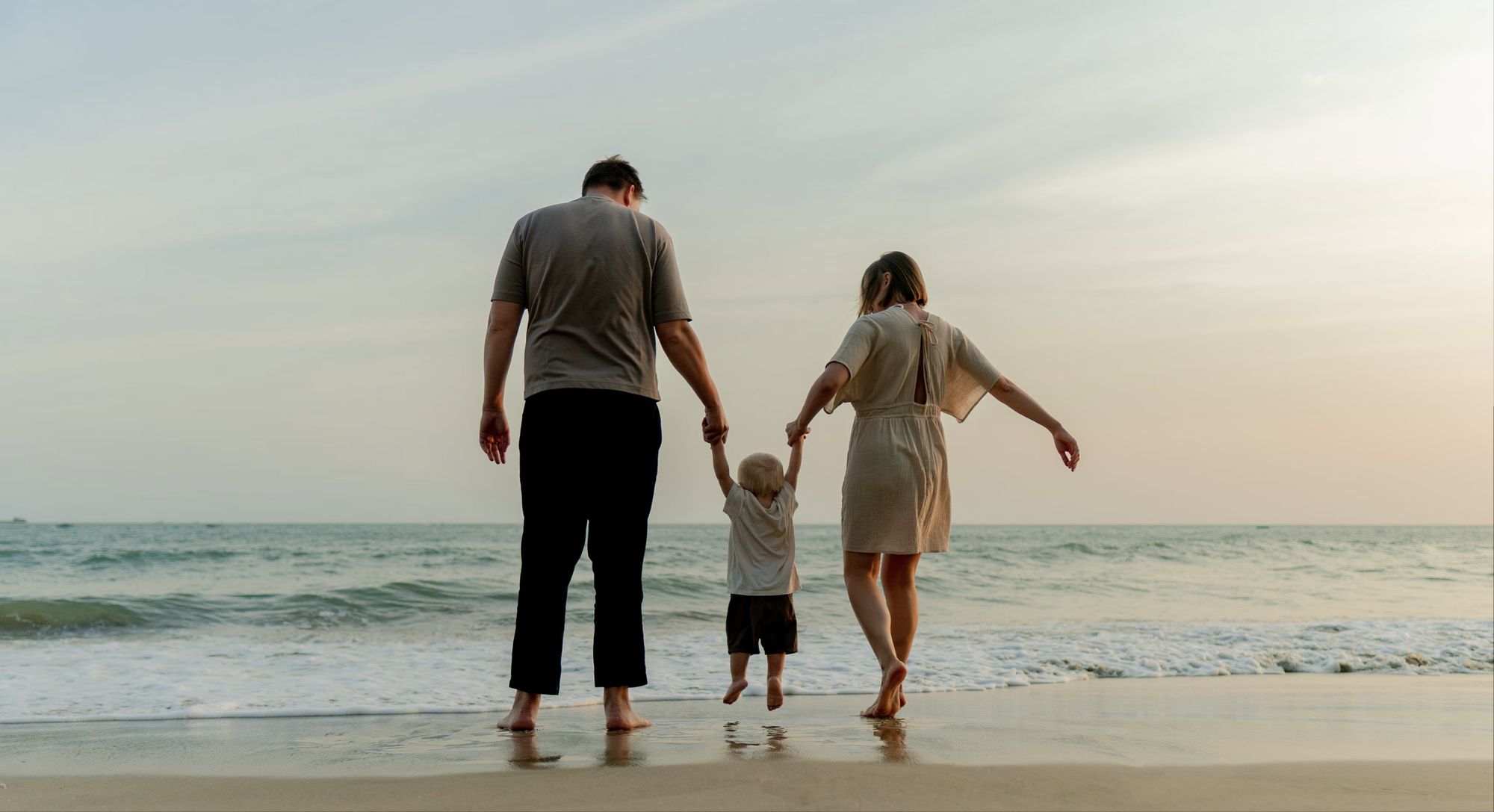 A family walking by the sea